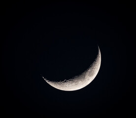 Crescent moon illuminating the night sky