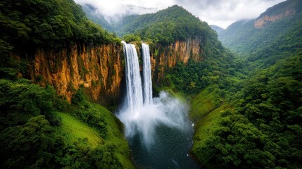 Fototapeta premium The majestic Agueraz Waterfall stands tall, cascading down lush green cliffs with a roaring intensity that mesmerizes all who lay eyes upon it.