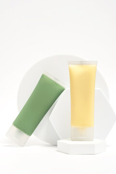 Two skin care face masks with green and yellow extracts