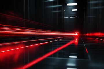 A powerful red laser beam scanning a sleek, glossy black surface. The laser leaves a glowing red trail as it moves horizontally across the surface.  