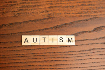 Wooden blocks with the word Autism. Neurological and developmental disorder. ASD