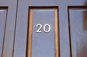 Shiny Black Painted Door with Number 20 in Close Up