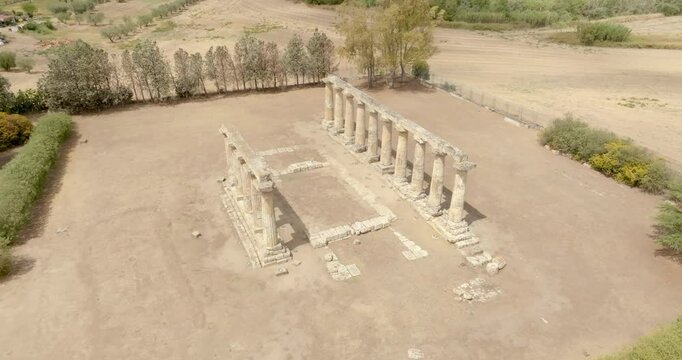 Aerial view of the Tavole Palatine ("Palatine Tables") located in Metaponto, Basilicata, Italy. Closeup of the remains of a hexastyle peripteral Greek temple of Magna Graecia.