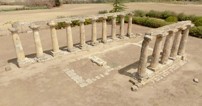 Aerial view of the Tavole Palatine ("Palatine Tables") located in Metaponto, Basilicata, Italy. Closeup of the remains of a hexastyle peripteral Greek temple of Magna Graecia.