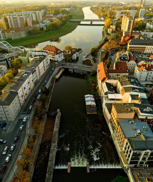 Odra River with bridges and old town of city Opole Poland from drone