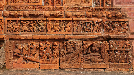 Terracotta carvings depicting a group boating scene on the walls of Ram Chandraji's Temple, Brindavan Chandra's Math, Guptipara, Hooghly, West Bengal, India.