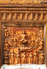 Terracotta sculpture of Tripura Sundari Goddess sitting on a lotus which grows from the naval of...