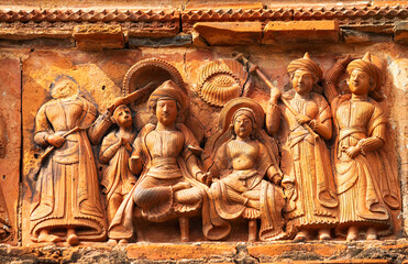 Fototapeta premium Rama and Sita seated on throne close view. Lakshmi Janardan Temple, Ghurisha , Birbhum, West Bengal, India.