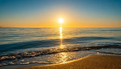 Obraz premium Golden Heart-Shaped Sunlight Reflected on Calm Ocean Waves During a Magical Sunrise