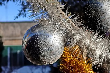 Happy New Year.Christmas tree decorations and toys for fir trees covered with snow and ice. Close-up. Merry Christmas.2024.