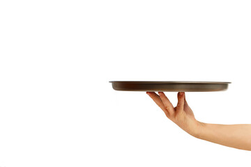 Man hand holding a metal tray on a yellow background with copy space