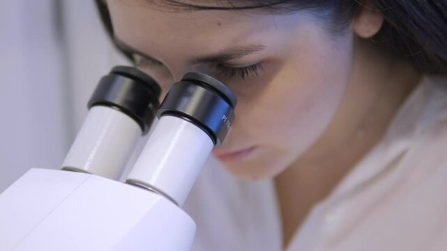 A Scientist Engaged in Detailed Research and InDepth Analysis Using a Microscope