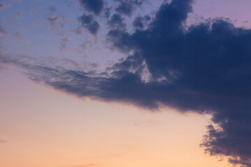 clouds on the sky at twilight. dramatic cloudscape. beautiful nature background in colorful light at dusk. stormy weather conditions