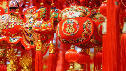 traditional Chinese New Year hanging ornaments, featuring auspicious symbols, and rich red and gold colors. These festive decorations, including tassels, knots, and lucky charms