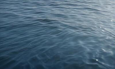 Naklejka premium Softly rippling water surface in the background with gentle waves and a subtle gradient of blue hues, ocean, nature, calming atmosphere