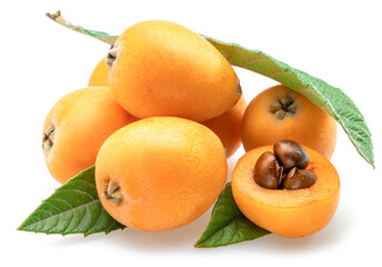 Ripe perfect loquat fruits with green leaves isolated on white background.