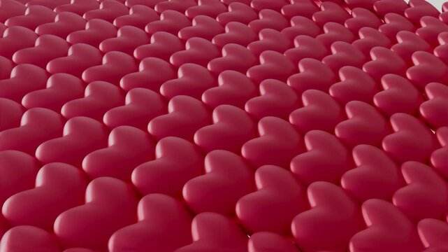 A close up of many red hearts in a row. The hearts are all the same size and are arranged in a pattern. Concept of love and affection, as the hearts are often associated with romantic feelings