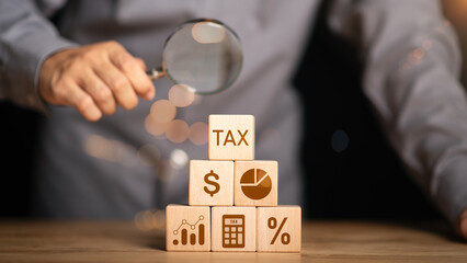 Businessman is managing documents online and calculating tax rates and business finance budget....