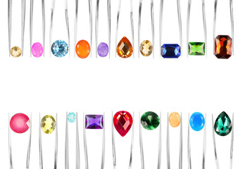 Tweezers with different shiny gemstones on white background, set