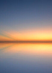 the reflection of a sunset in the Caribbean Sea