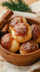 Delicious cinnamon rolls with sesame seeds in a rustic bowl, perfect for a cozy meal.
