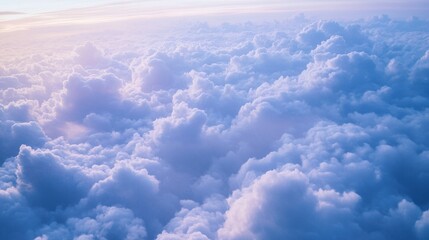 Aerial view of fluffy clouds at sunrise.