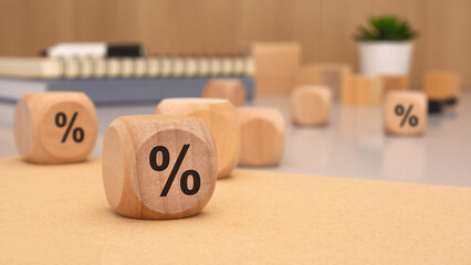 Wooden Blocks Displaying the Percentage Symbol on a Desk Representing Financial Concepts and Ideas