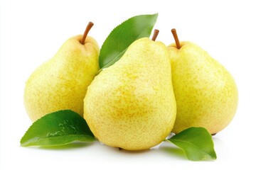 Fresh yellow pears with green leaves arranged together on a bright background showcasing their natural beauty