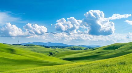 Fototapeta premium A serene landscape showcasing a wind farm on picturesque rolling hills under a bright blue sky with fluffy white clouds, symbolizing renewable energy and sustainable living.