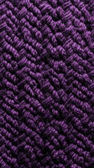 Close-up textured purple fabric.