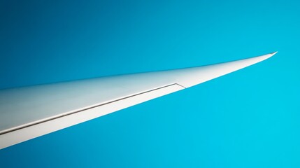 Close-Up of Wind Turbine Blades Against Blue Sky