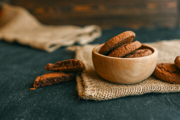 Chocolate brownie cookies in a wooden plate, sweets