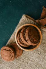 Homemade cookies in a wooden plate, background