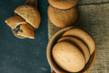 Chocolate brownie cookies in a wooden plate, sweets
