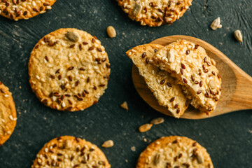 Wooden spoon with homemade cookies with siftings and flax