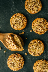 Wooden spoon with homemade cookies with siftings and flax