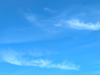 Big White Fluffy Clouds on A Blue Sky With Fine Whispy Lines