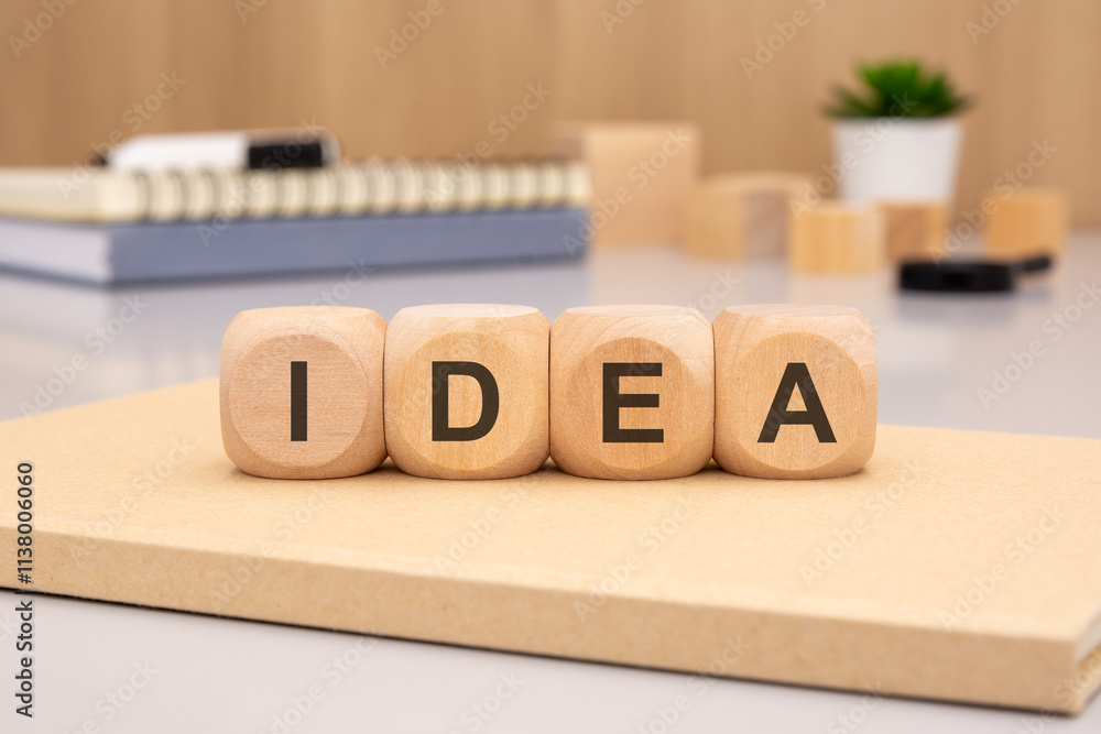 Poster imaginative and unique creative idea concept displayed on an office desk utilizing wooden blocks
