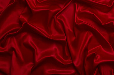 The top view of the red satin surface looks luxurious and beautiful. with sparkling waves Abstract background design copy space Card or banner (blurred or blurry)
