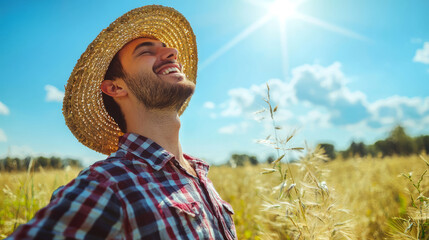 Obraz premium Young man in straw hat enjoying a sunny day in the field