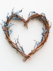 Fototapeta premium Woven heart-shaped wreath decorated with blue flowers and twigs.
