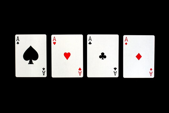 Four types of cards from the deck lie on a black background.