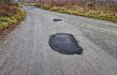 repairing a dirtroad with asphalt is against all regulations. two disparate materials never join...