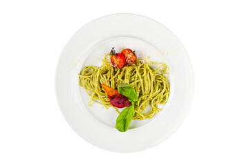 Pasta with homemade pesto sauce isolated on white background. Italian pasta served with tomatoes and basil.