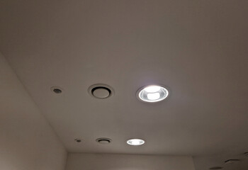 the ceiling of the corridor in plasterboard soffit is equipped with a circle of light. vapor and...