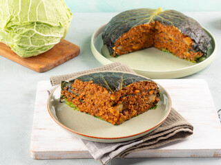 Chou farci, stuffed savoy cabbage pie with lentil quinoa ragu