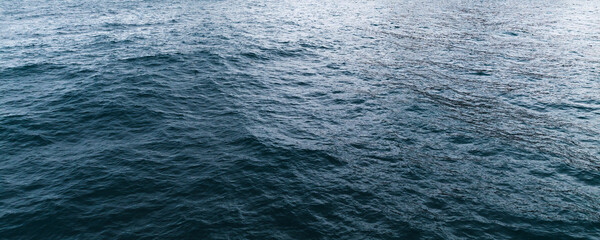 Deep blue sea water surface with ripple and waves pattern