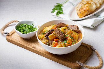 Slow cooked beef stew with potatoes, carrots and onions