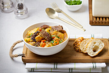 Slow cooked beef stew with potatoes, carrots and onions