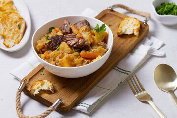 Slow cooked beef stew with potatoes, carrots and onions